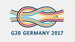 Logo G20-Germany 2017 na którym widać trójkolorowe skrzyżowane paski w tym napis 