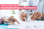ręce dwóch osób obok dokumentu. Jedna z osób trzyma ołówek, druga wskazuje na fragment dokumentu.